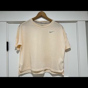Nike dry-fit running shirt. Never been worn, tags removed.